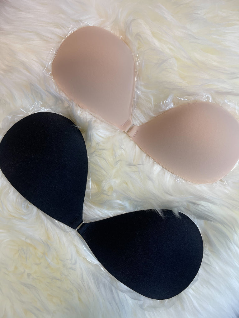 nude bra black bra on white fur