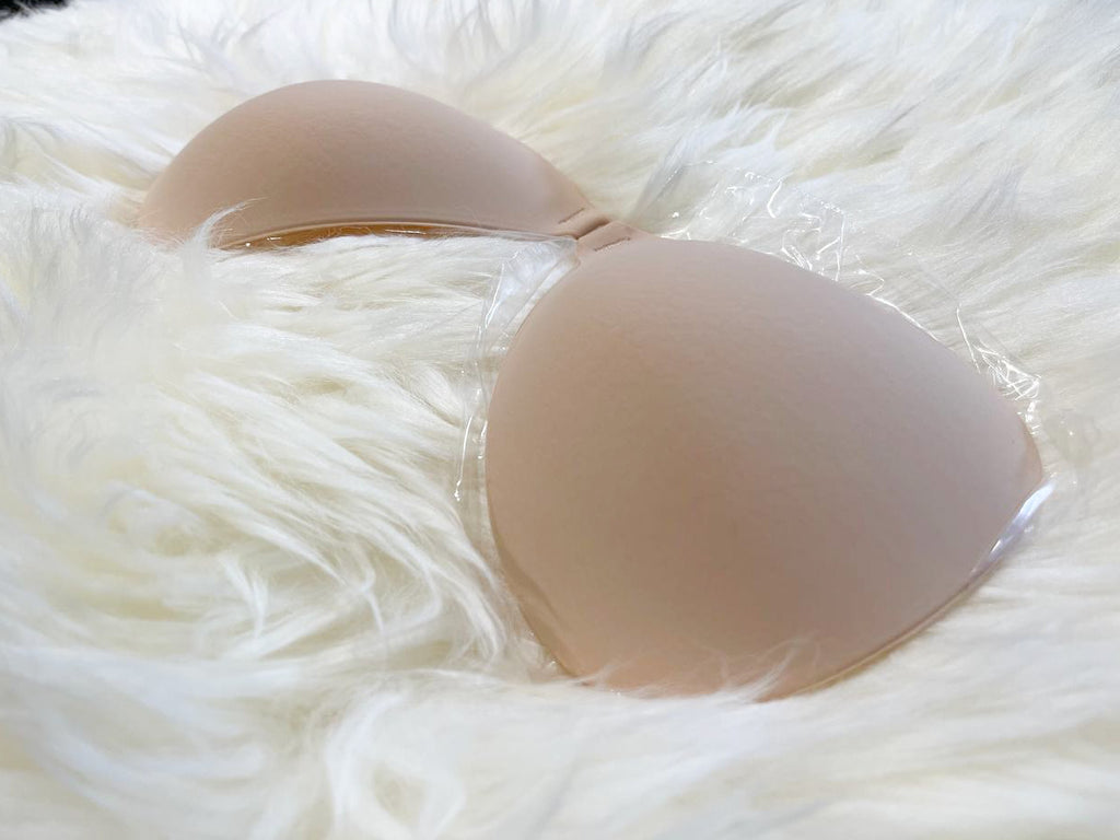close up of nude bra on white fur